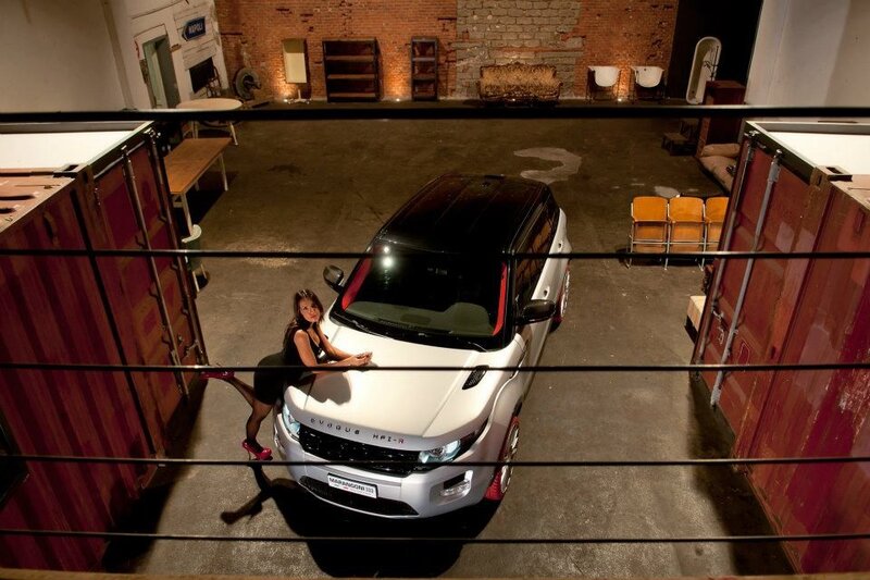 Woman posing with luxury car