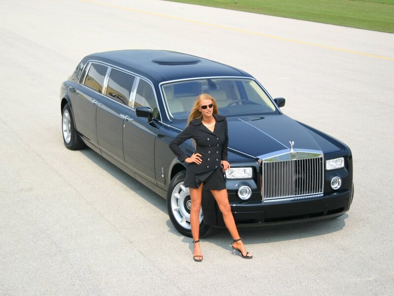 Woman posing with luxury car