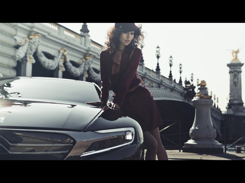 woman posing with luxury car