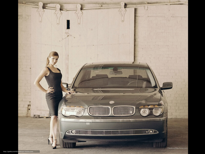 woman posing with luxury car