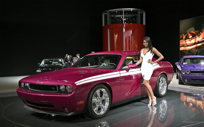 Woman posing with magenta car