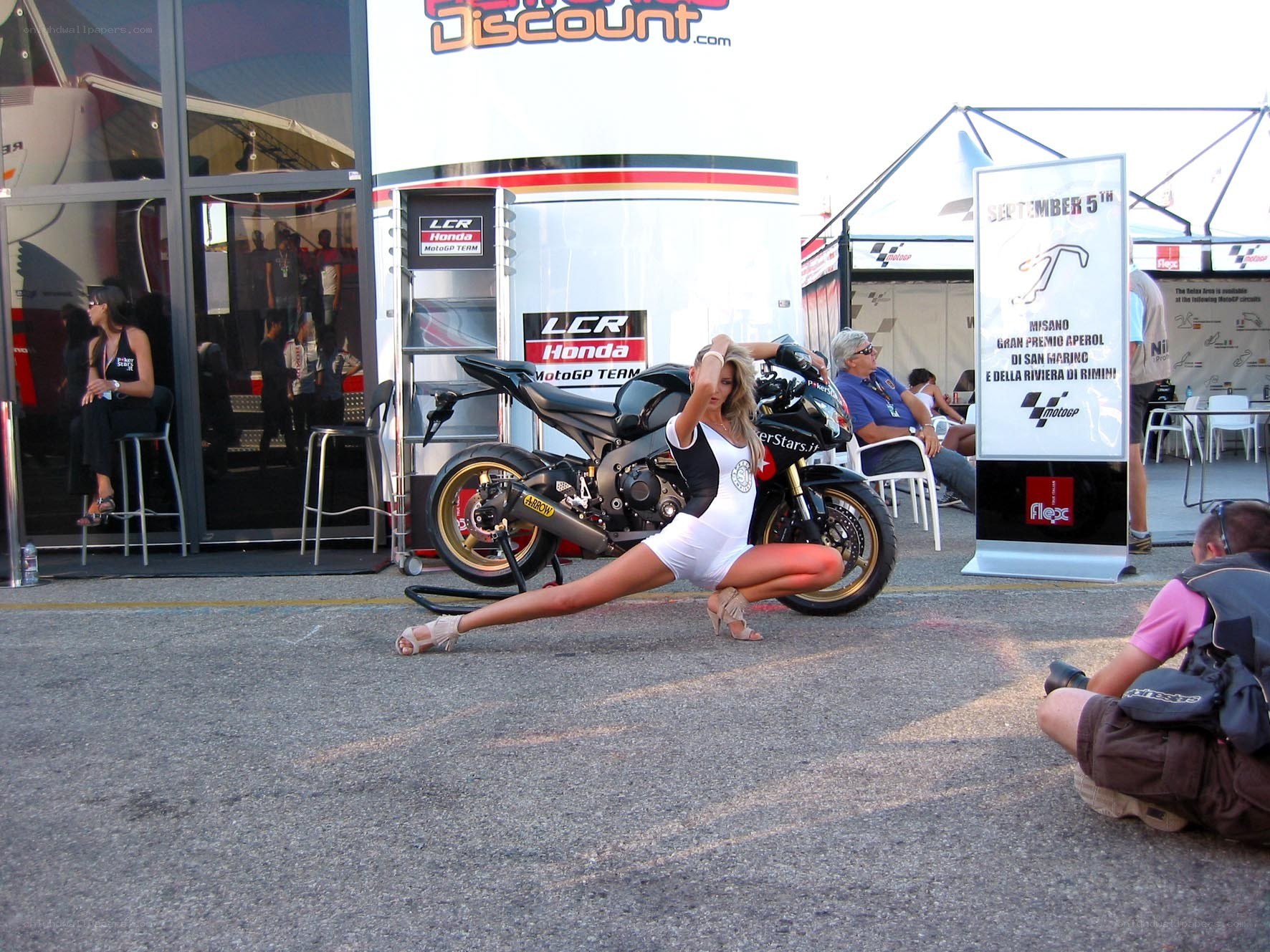 Woman posing with motorcycle