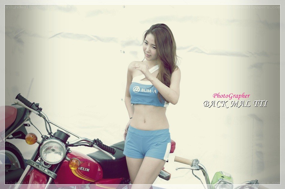 Woman posing with motorcycle