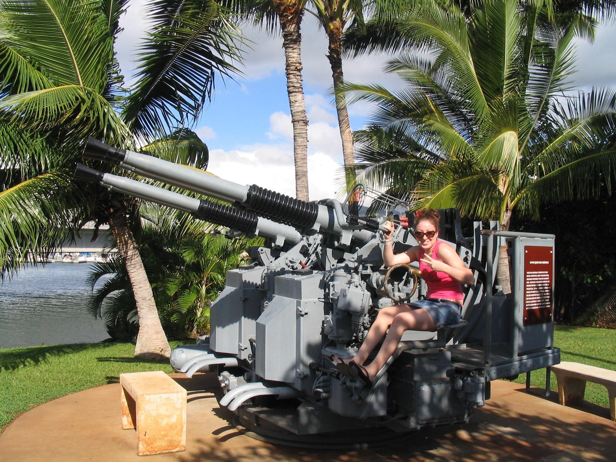 Woman posing with naval gun