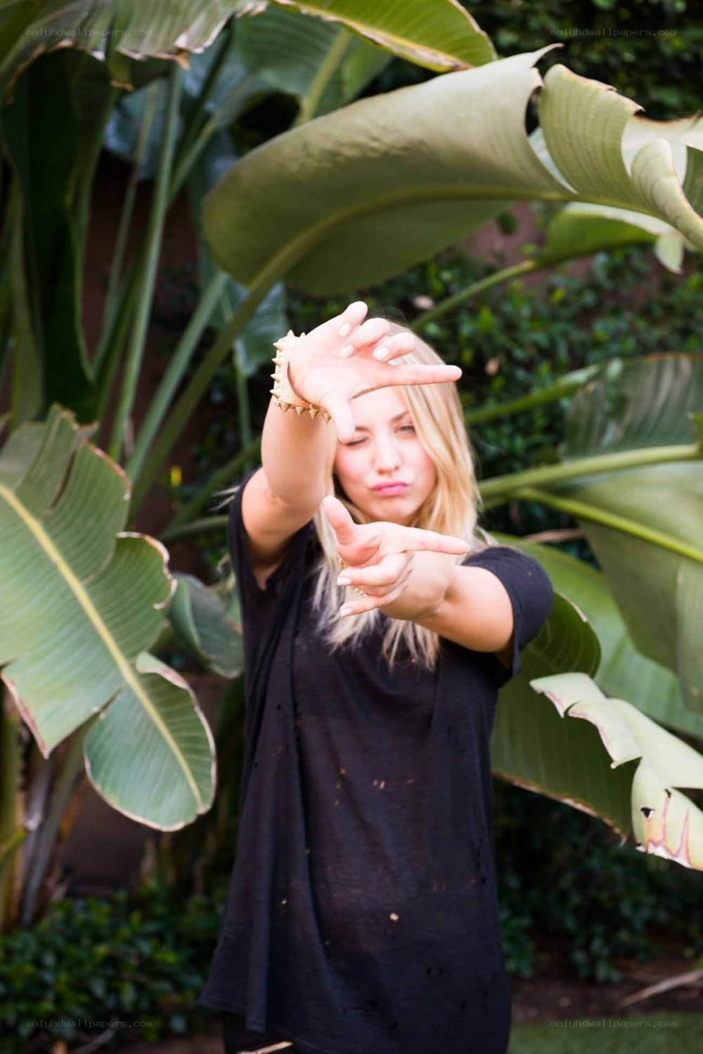 woman posing with plants