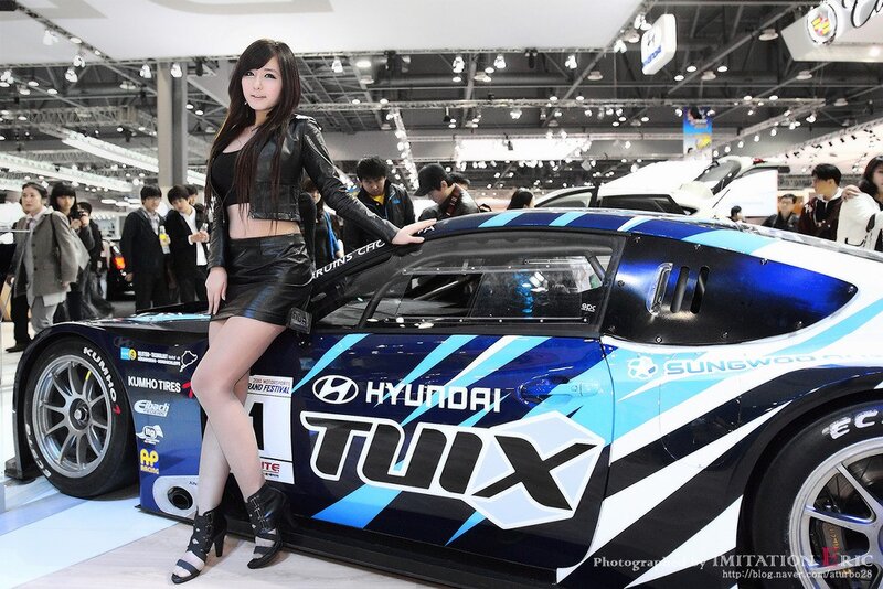 Woman Posing with Race Car — Blue
