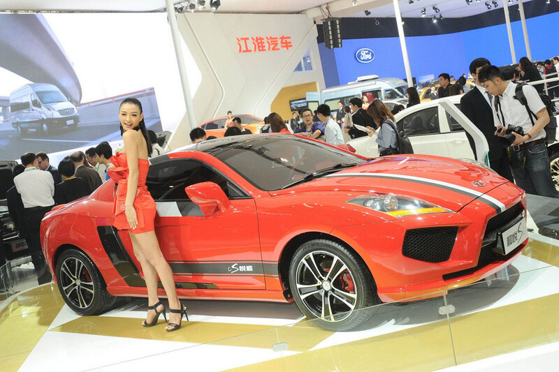 Woman Posing with Red Car — Busy