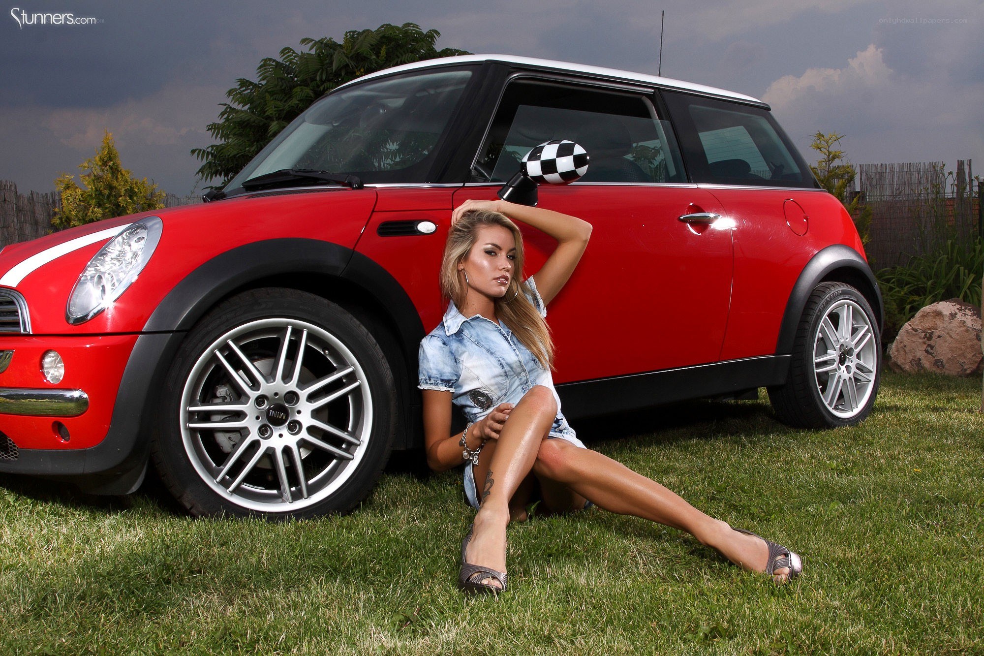woman posing with red mini cooper