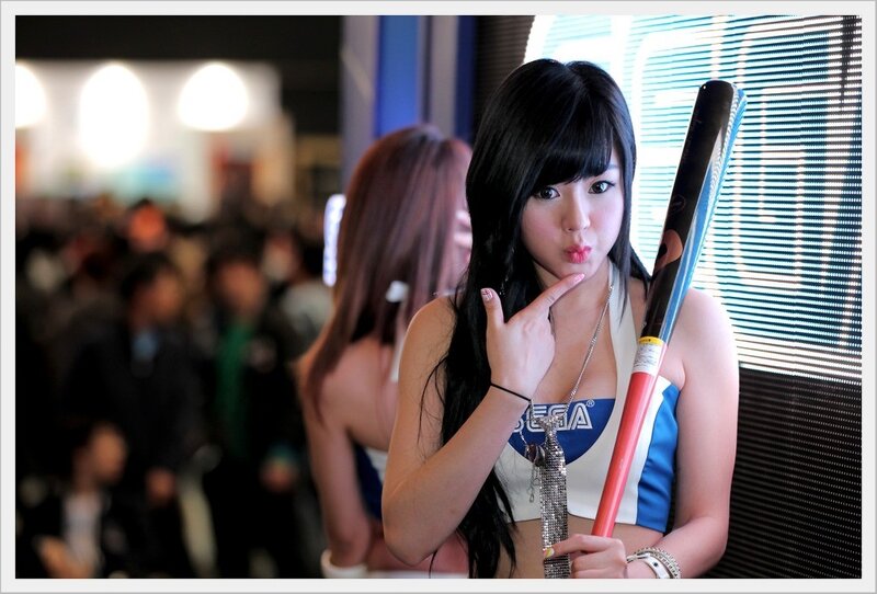 Woman posing with Sega baton