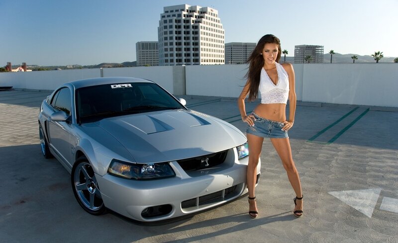 woman posing with silver car
