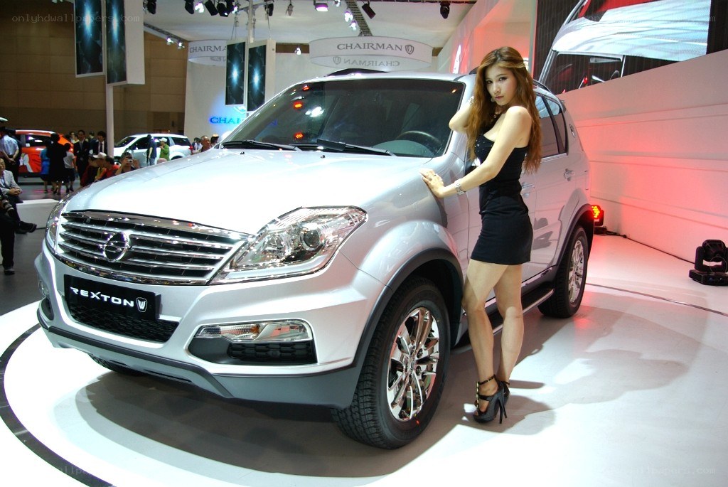 Woman posing with silver SUV