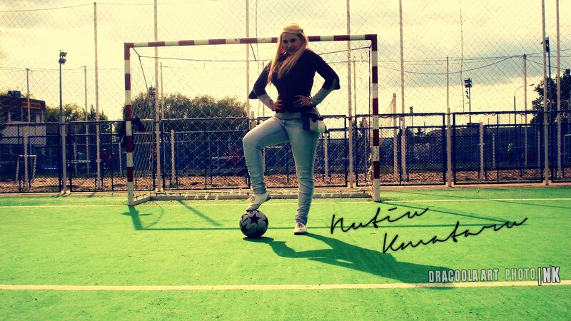 woman posing with soccer ball