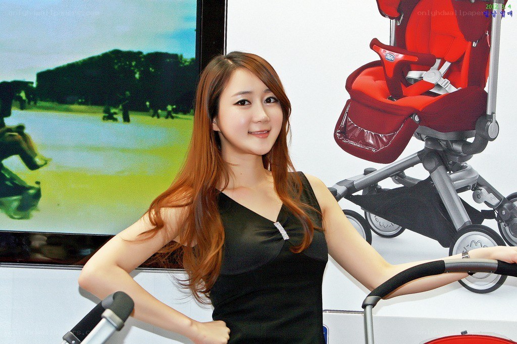 Woman posing with stroller at event
