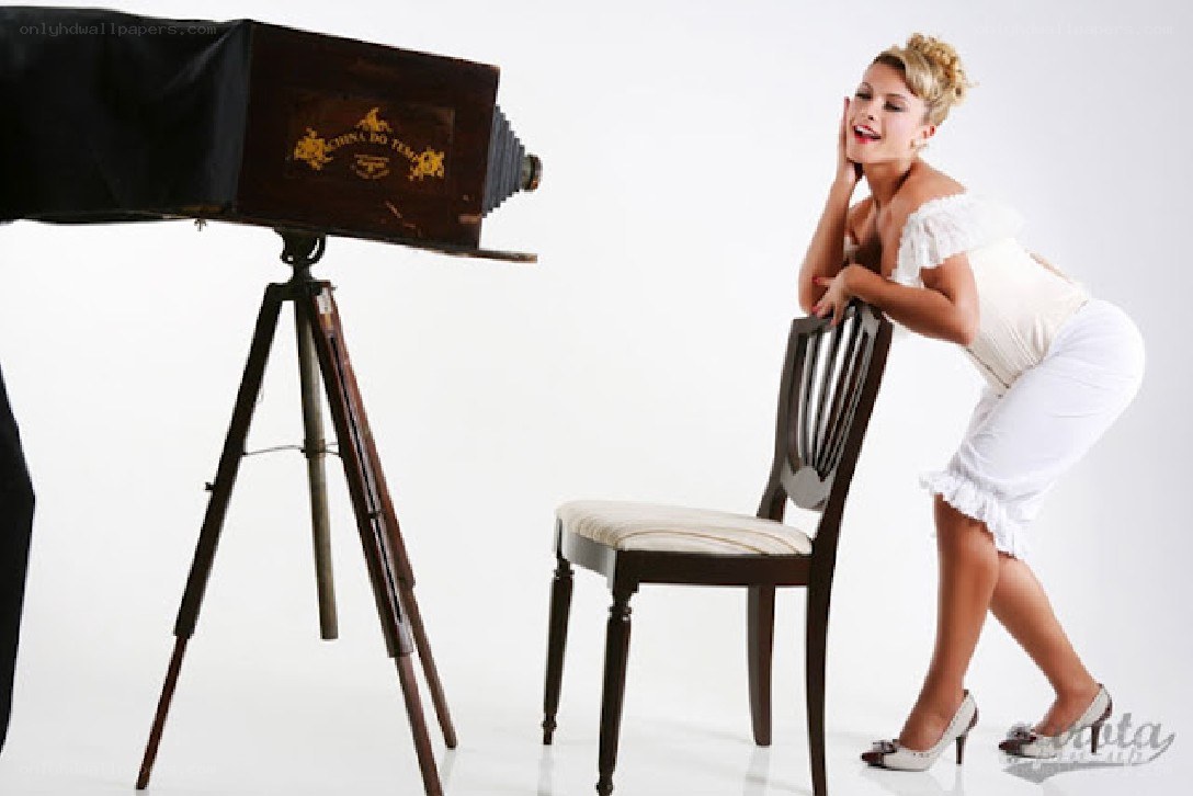 woman posing with vintage camera