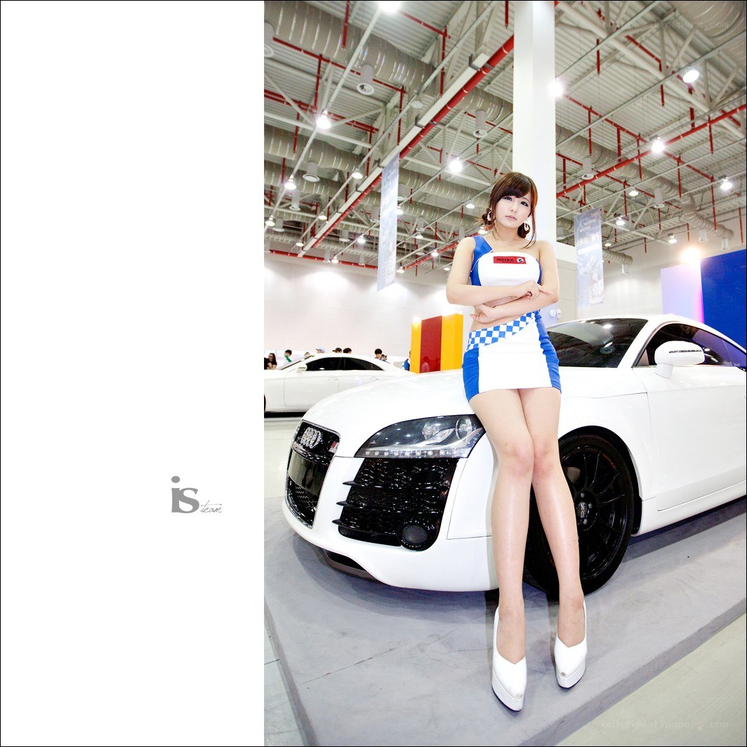 Woman posing with white car