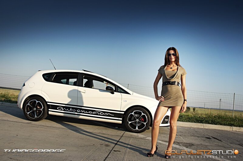 woman posing with white car