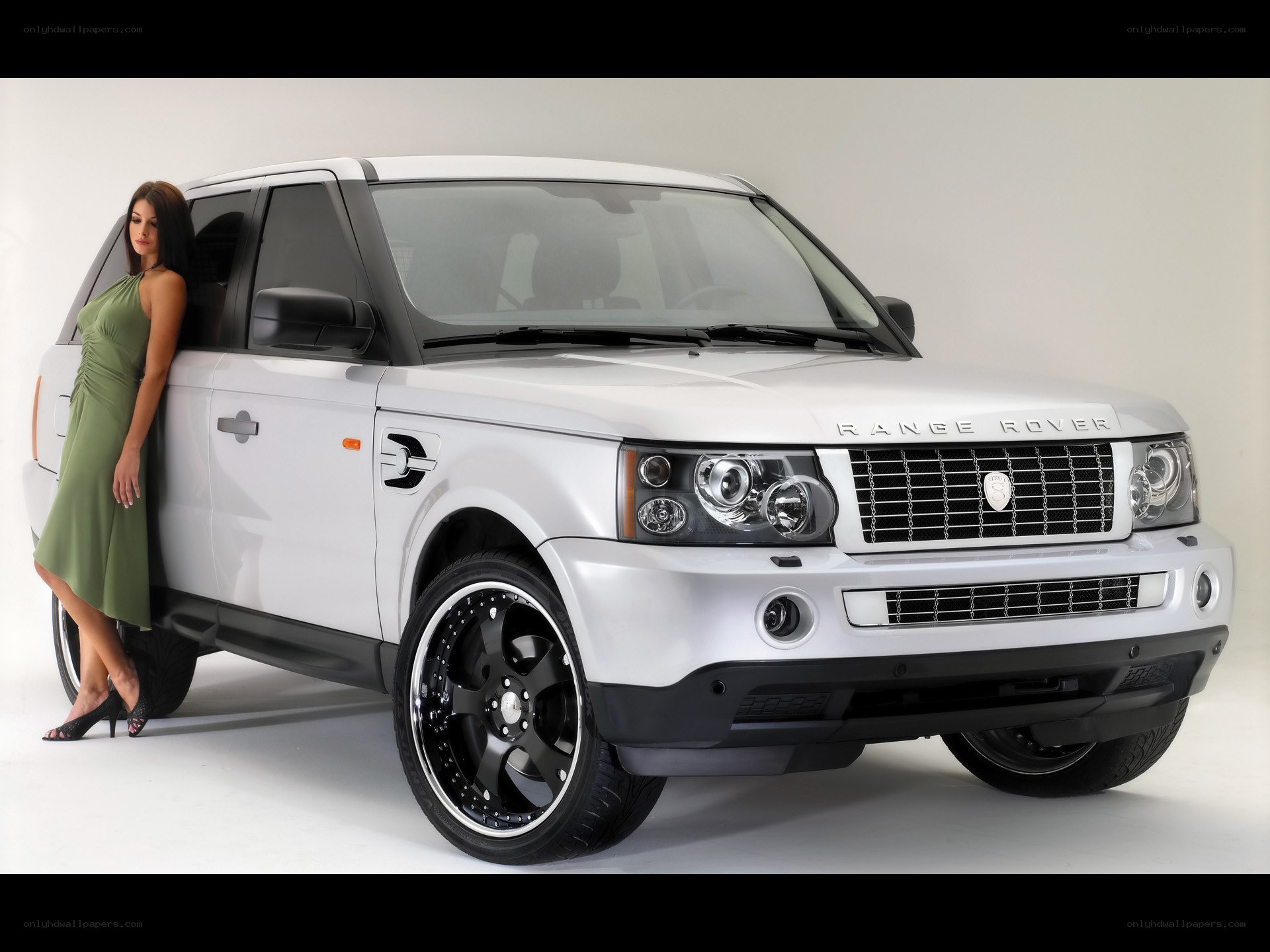 Woman posing with white Range Rover