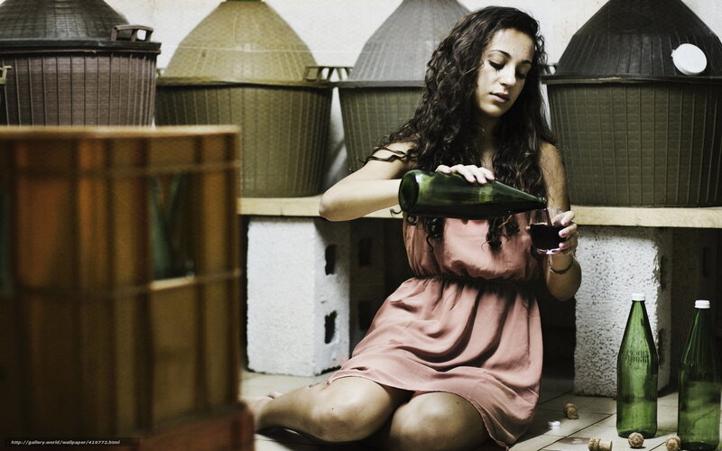 woman pouring wine in cellar