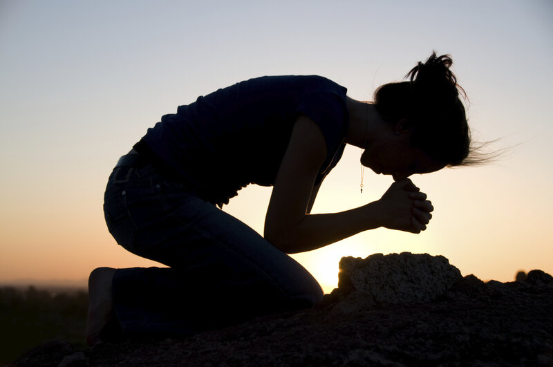 Woman Praying at Sunset — Orange
