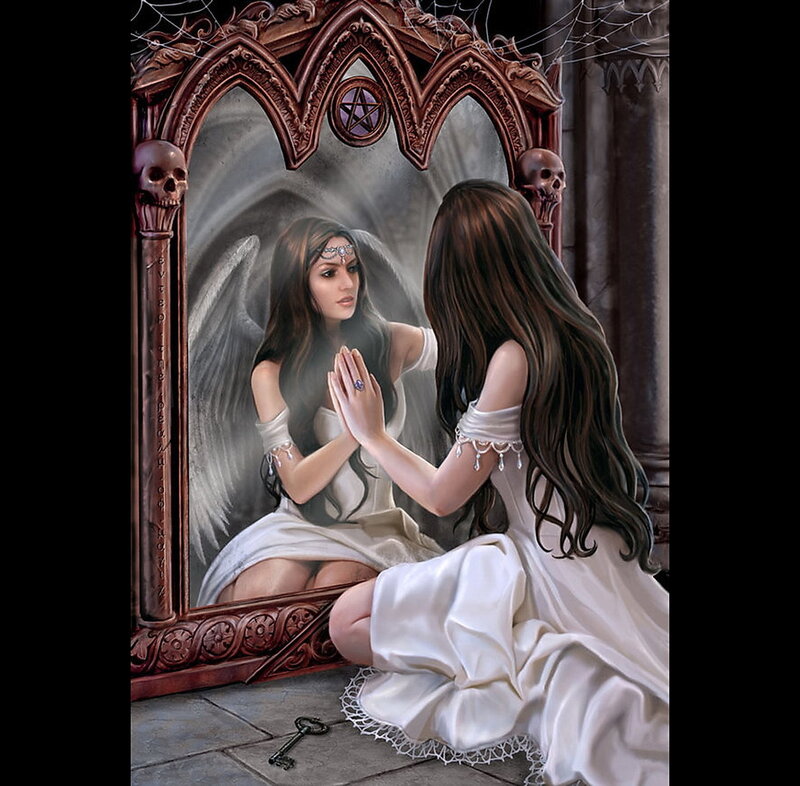 woman praying before mirror