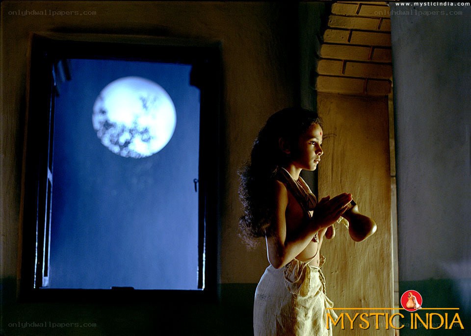 woman praying by moonlight