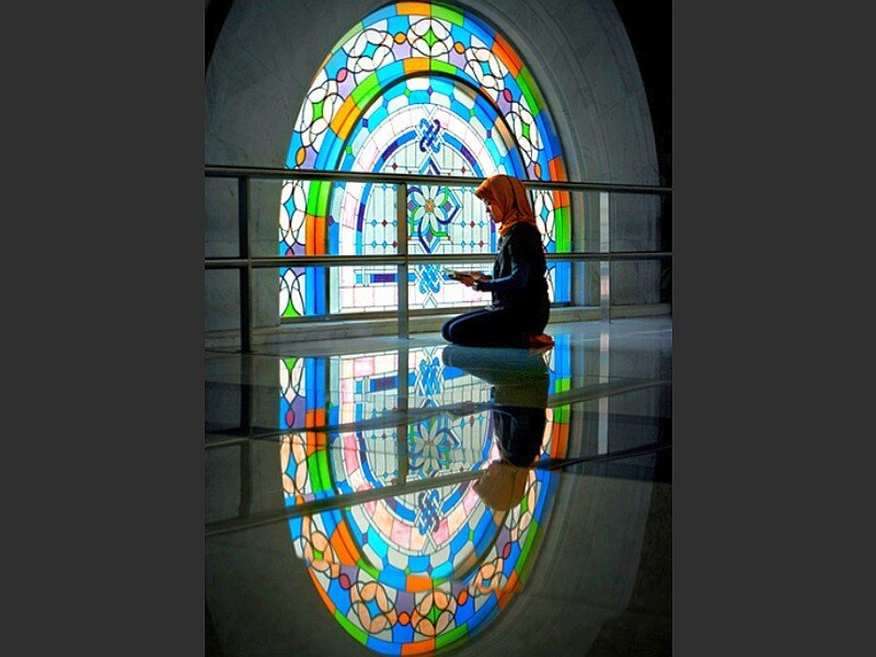 Woman praying in a mosque