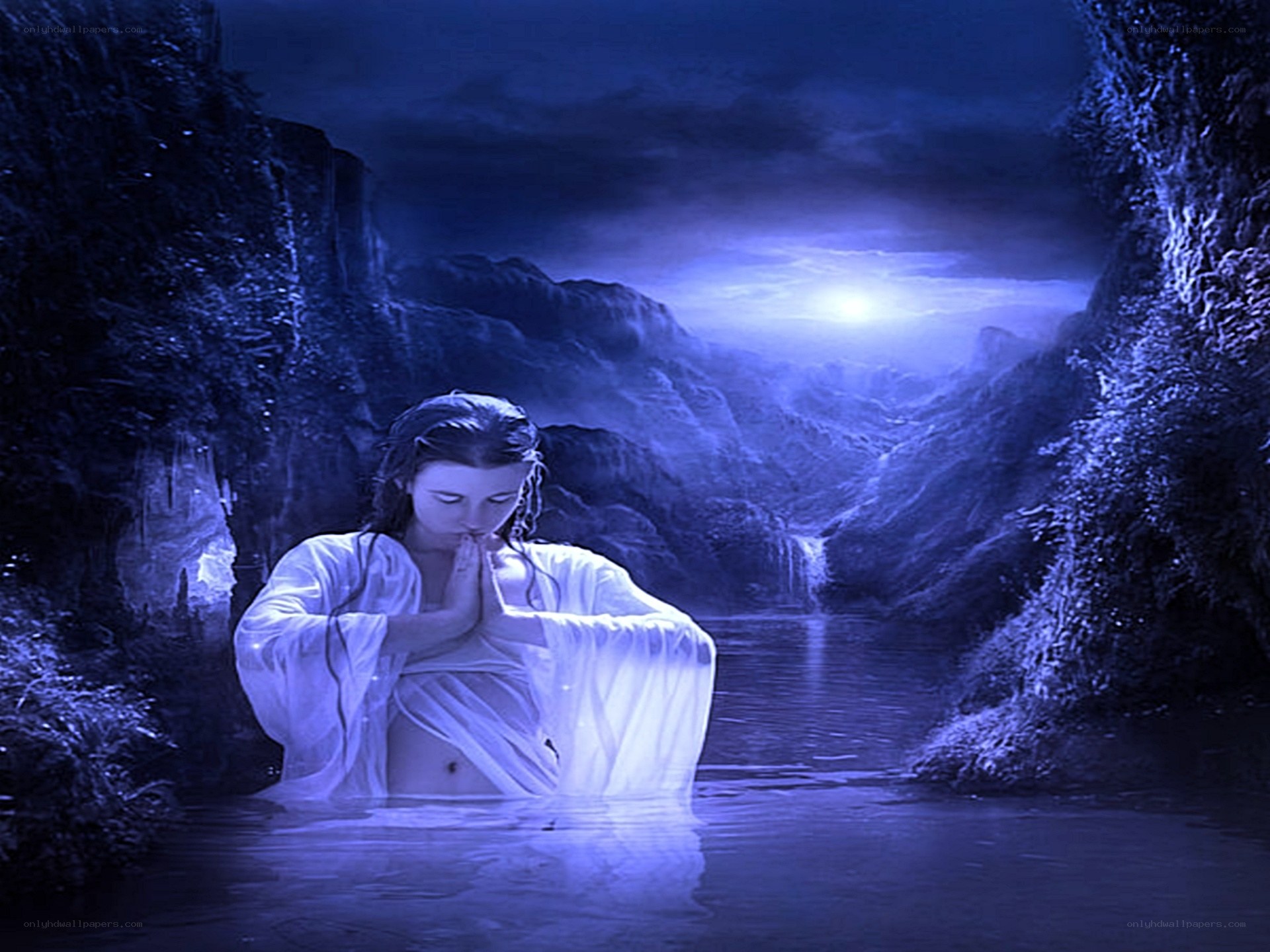 woman praying in a river