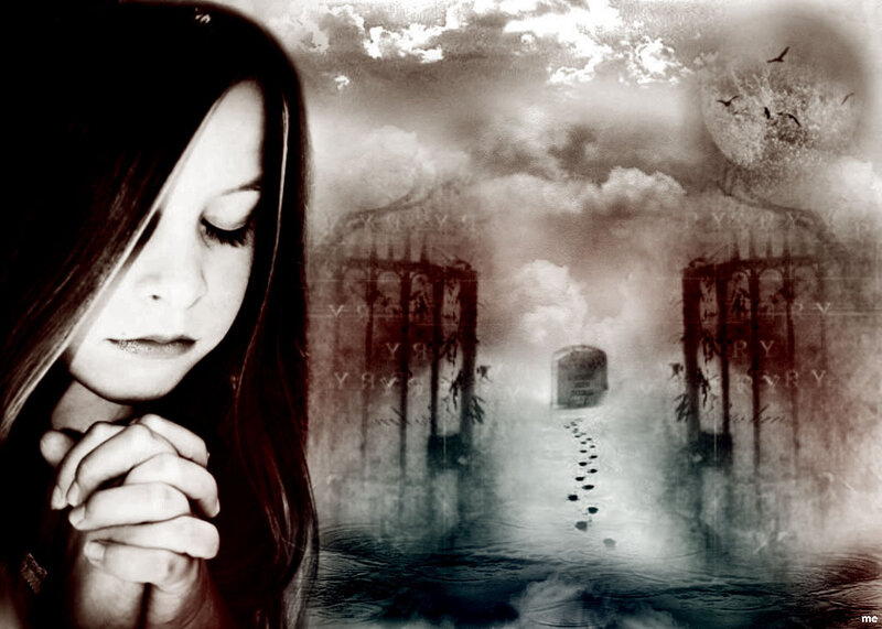 Woman Praying in Cemetery