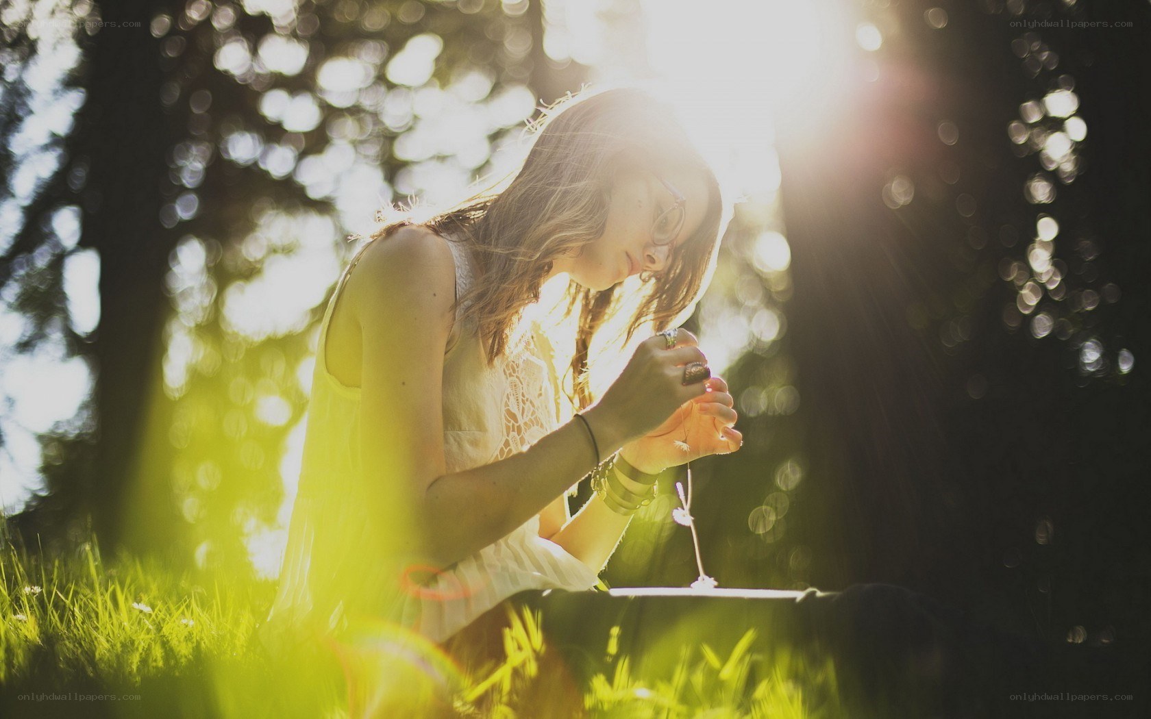 woman praying in sunlight