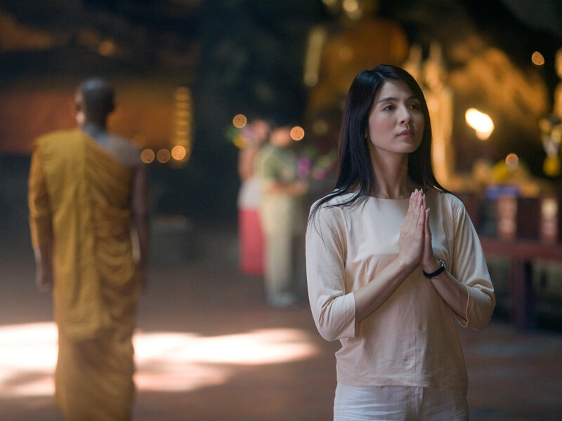 Woman Praying in Temple