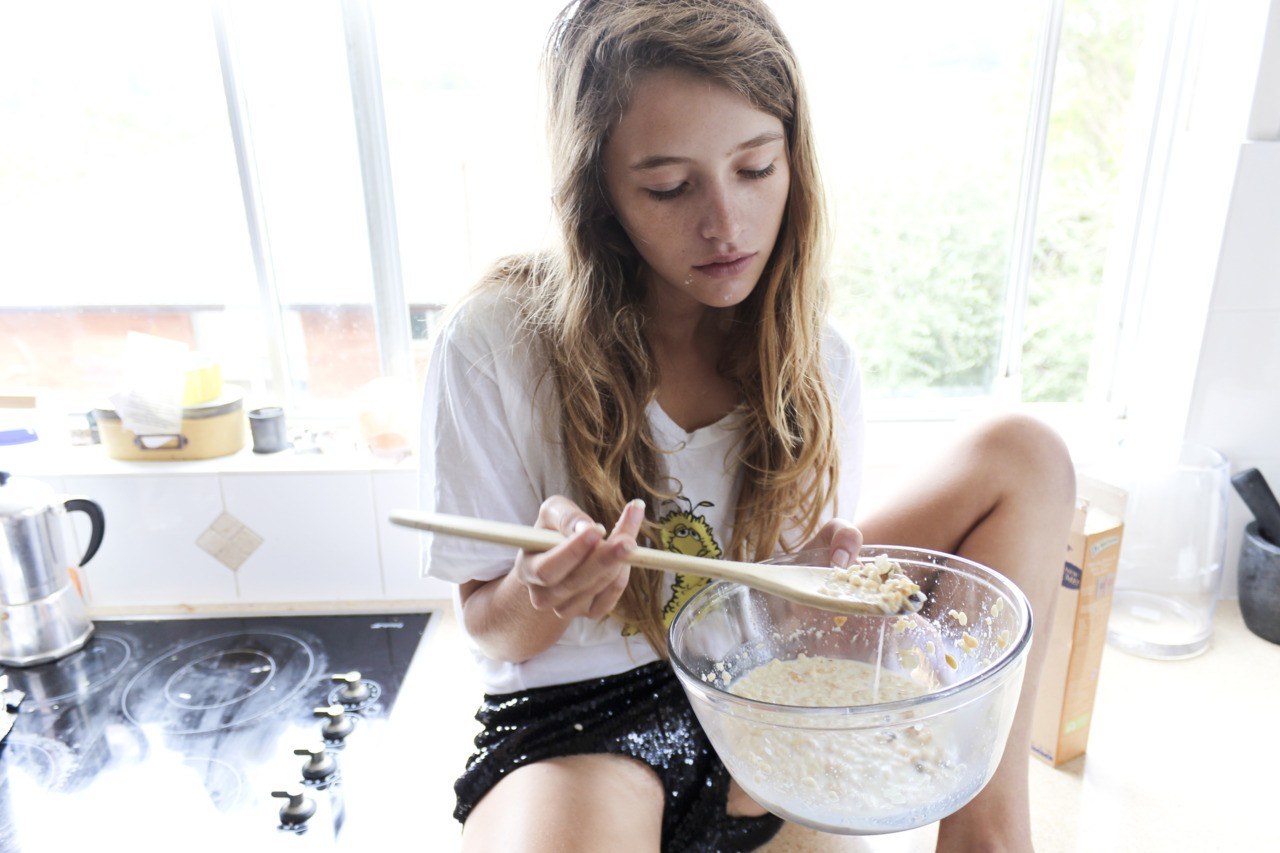 woman preparing breakfast in kitchen