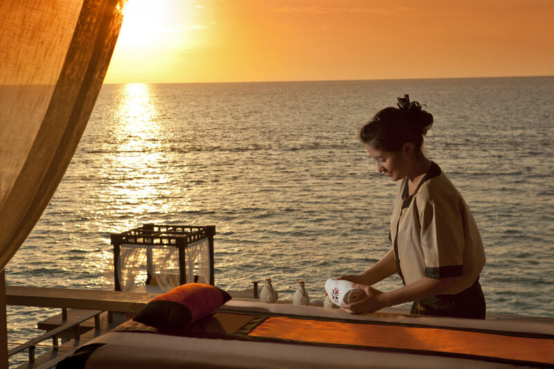 Woman Preparing Massage Table