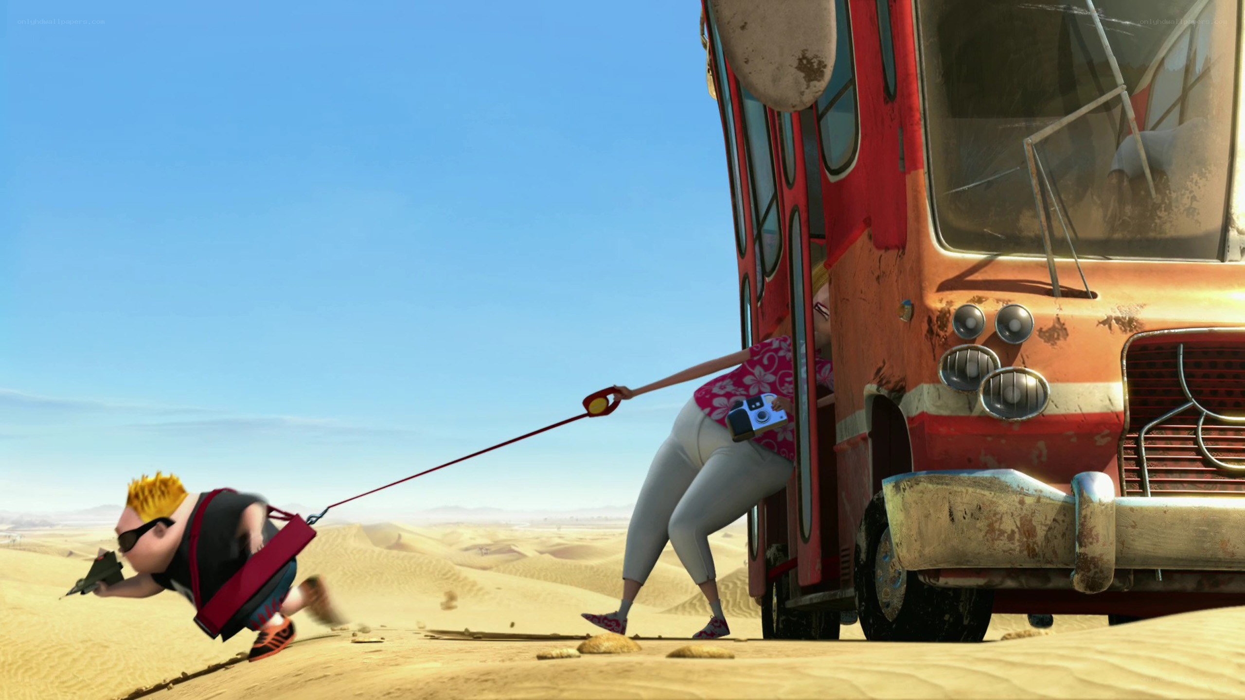 woman pulling man in desert