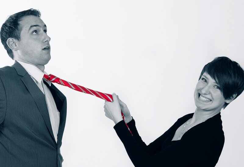 Woman Pulling Man's Tie