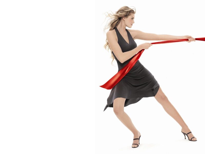 woman pulling red ribbon