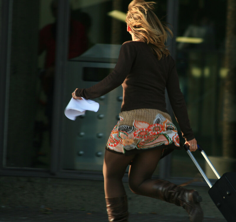 Woman Pulling Suitcase