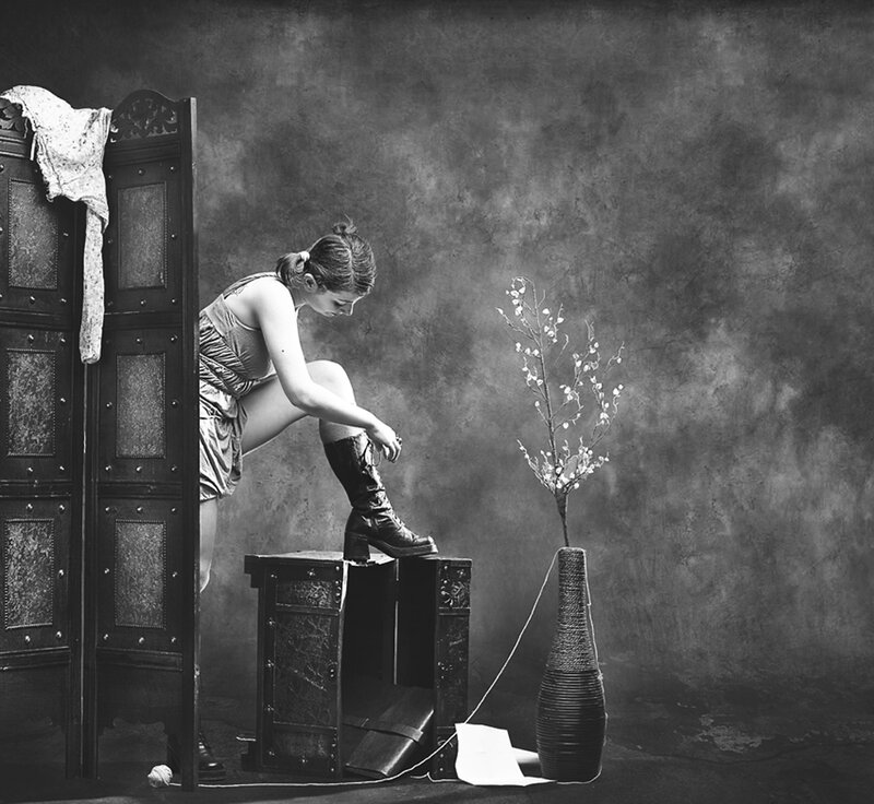 Woman Putting on Boot