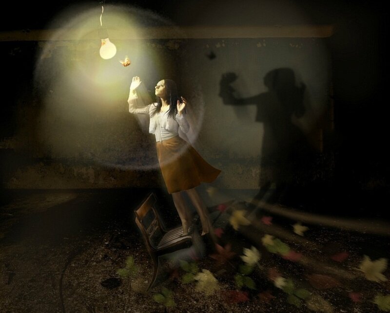 Woman Reaching for Light Bulb