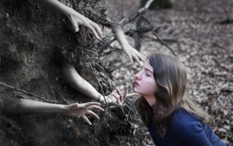 Woman Reaching Toward Tree