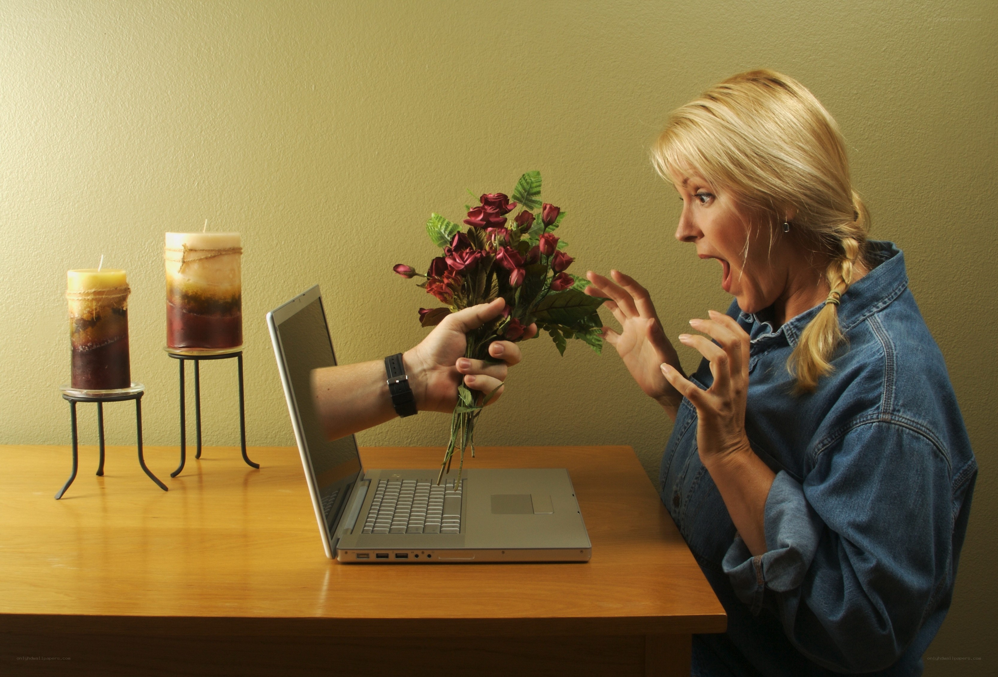 woman reacts to flowers from laptop
