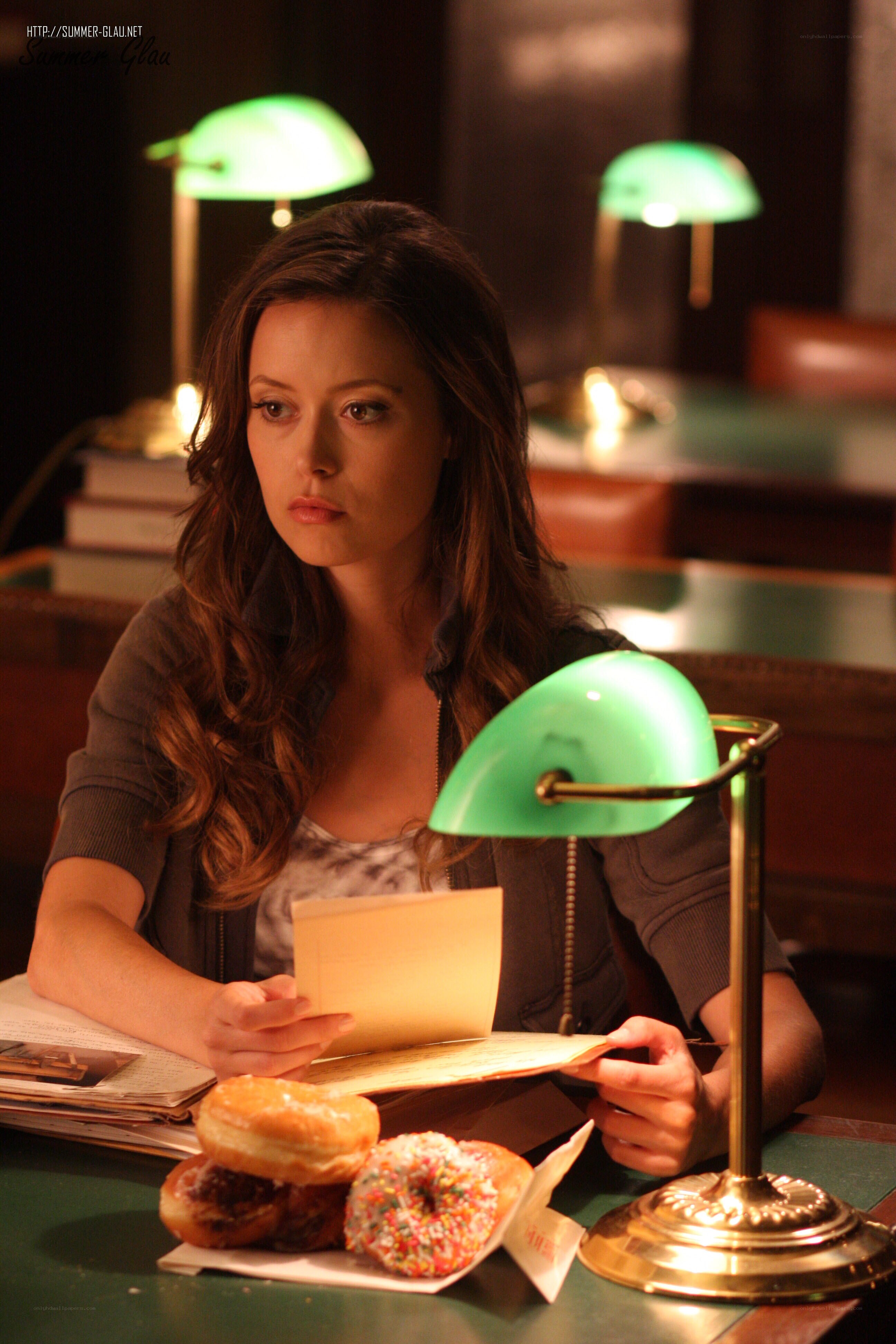woman reading at a table