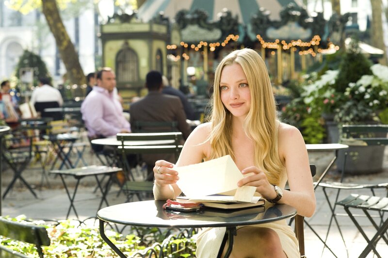 Woman reading at outdoor cafe