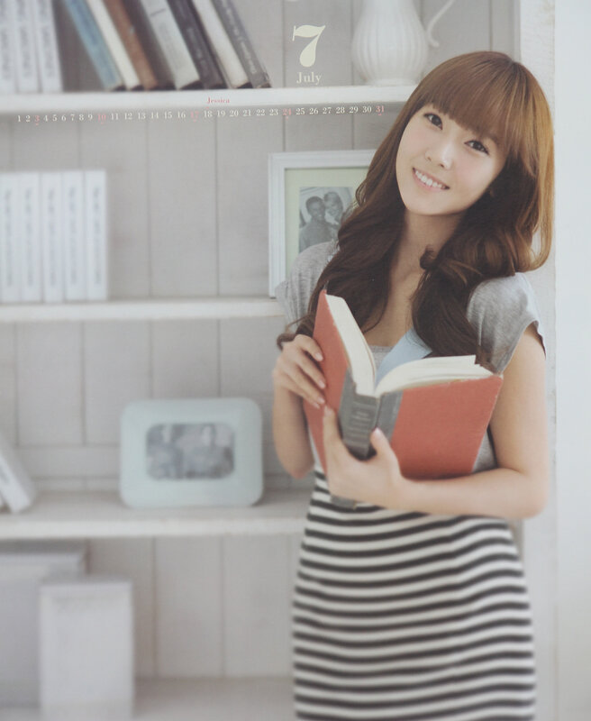 woman reading book in library