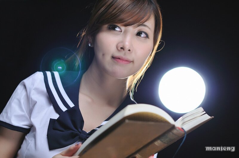 woman reading book in sailor uniform