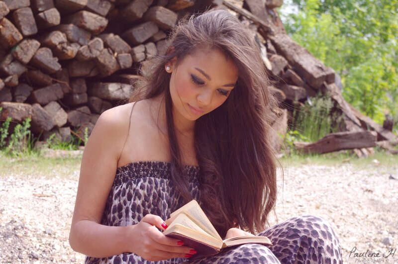 woman reading book outdoors