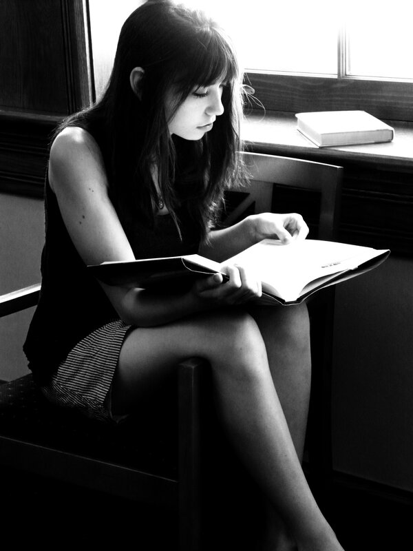 woman reading by window