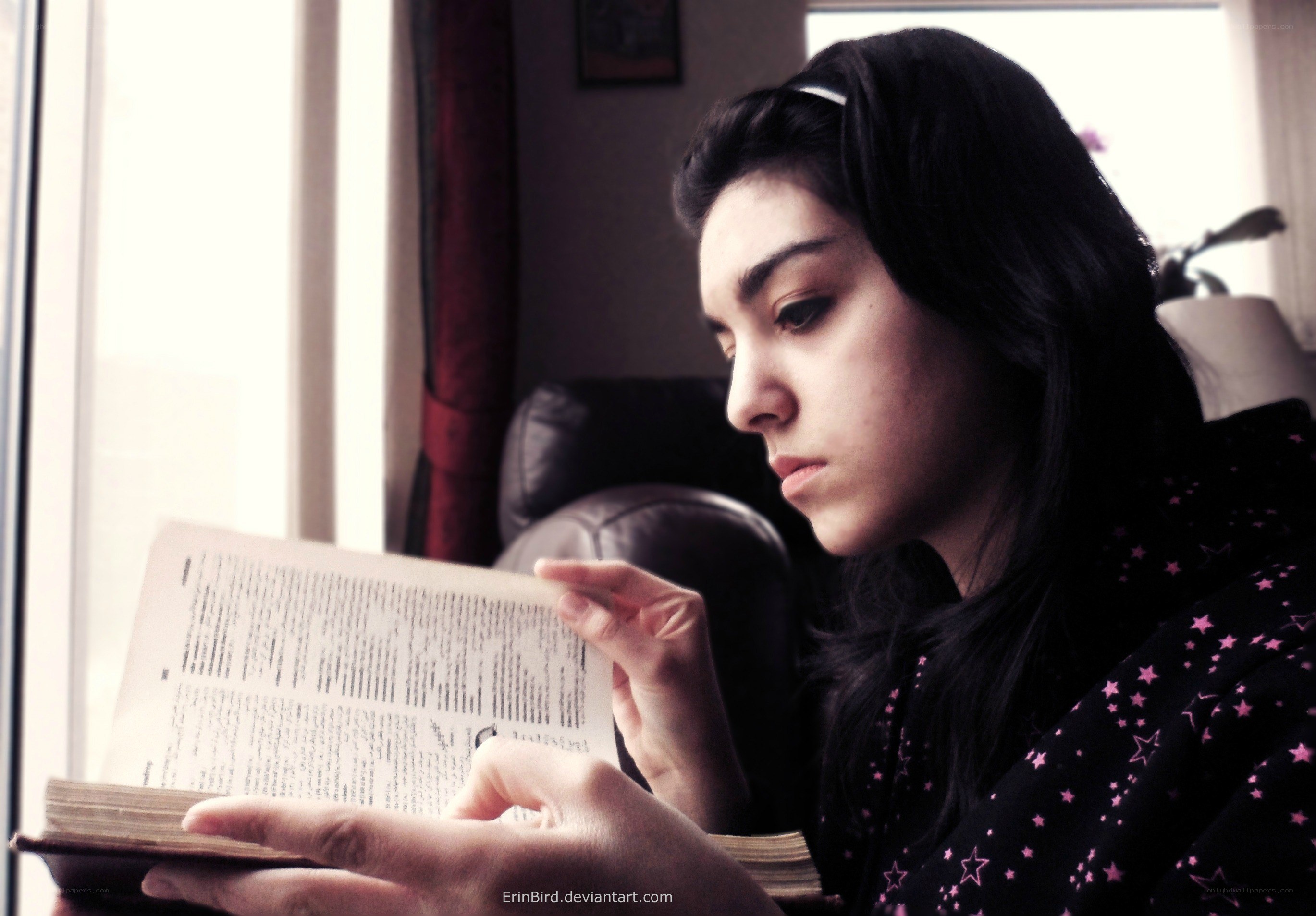 woman reading by window