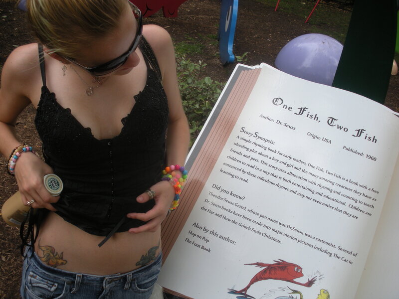 woman reading children's book