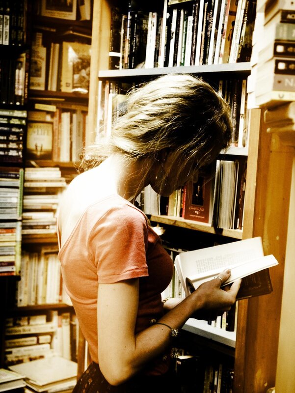 woman reading in a bookstore