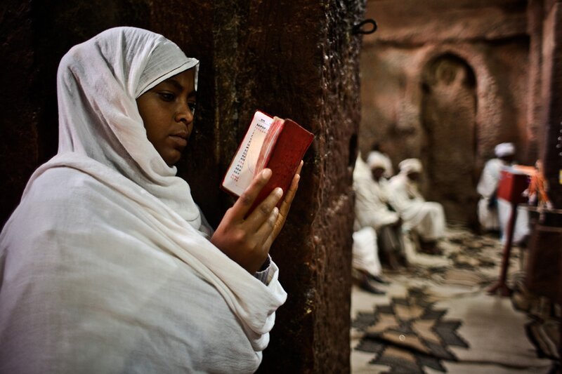 Woman reading in a church